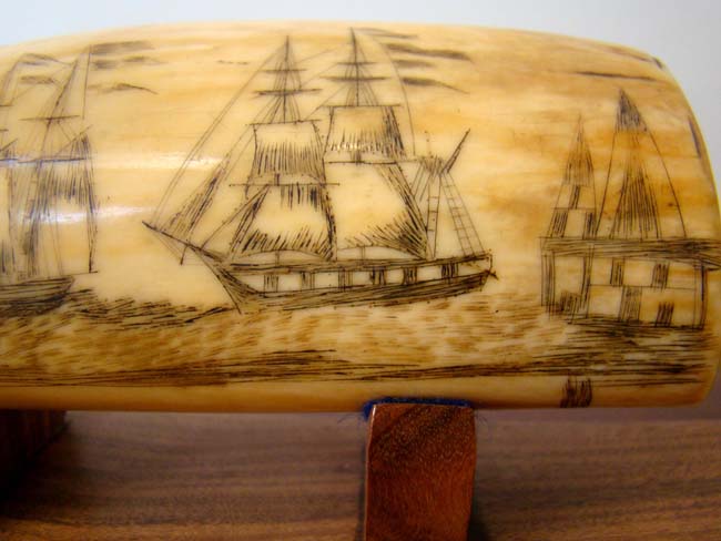 A 19th century Scrimshawed Whale's Tooth depicting a ship firing at an American fort and the fort firing back with its' cannons. — image 2